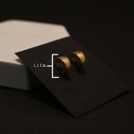 Mini Solace Gold Huggies Earrings - Image 4